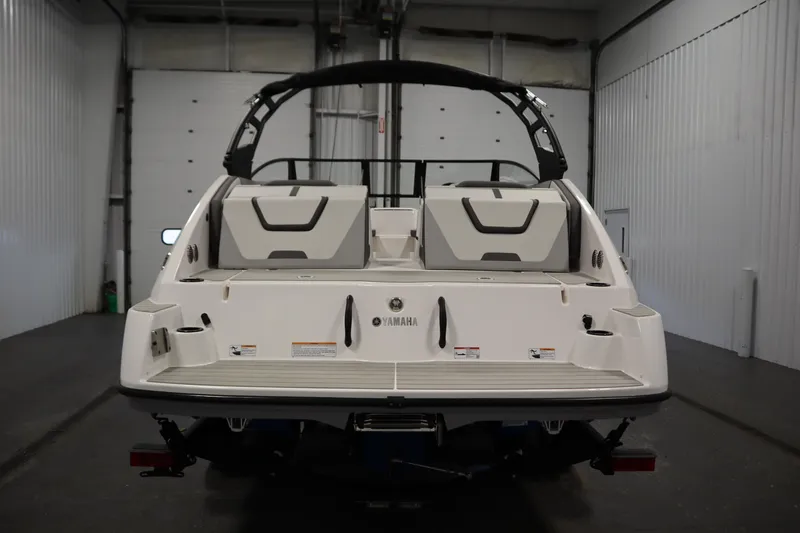 Slide: The Image of 2026 Yamaha Boats AR220, rear view in a garage setting. - 5