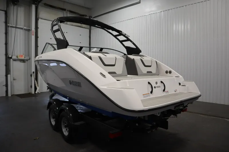 Slide: The Image of 2026 Yamaha Boats AR220 in a showroom, showcasing sleek design and modern features. - 6