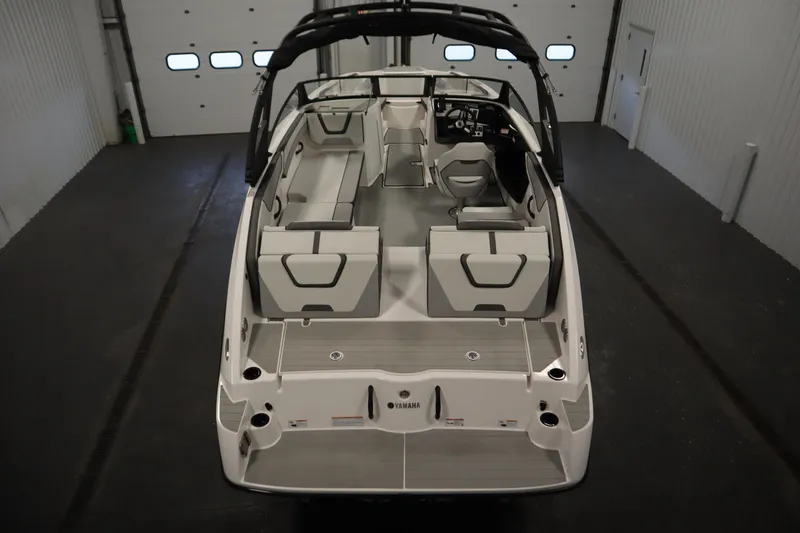 Slide: The Image of 2026 Yamaha Boats AR220 interior view in a garage setting. - 9