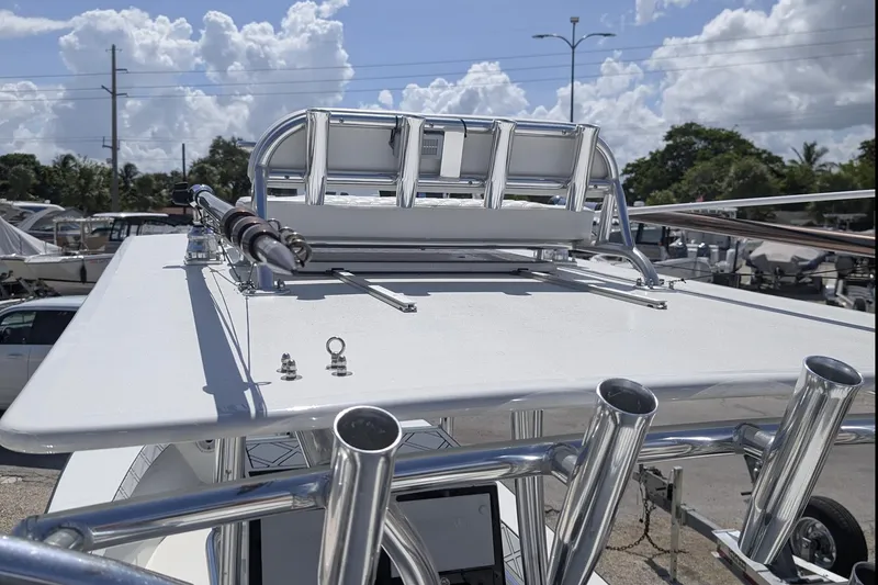 Slide: The Image of Boat helm of a 1985 Contender 25 Sport with steering wheel and Simrad equipment. - 13