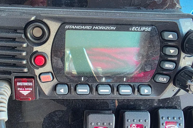 Slide: The Image of Standard Horizon Eclipse marine radio on 1985 Contender 25 Sport boat dashboard. - 21