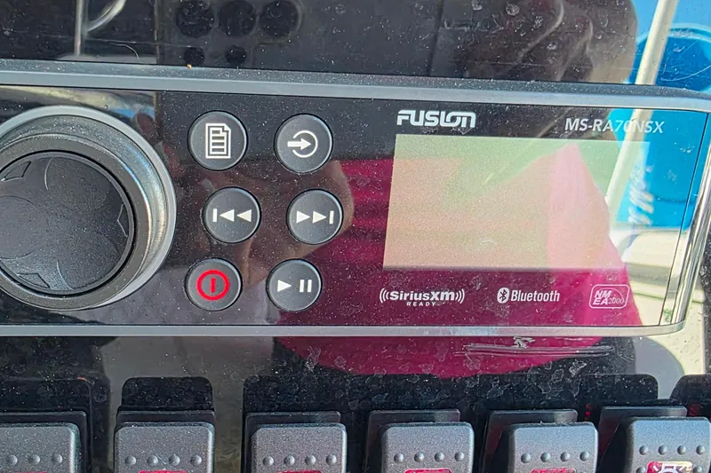 Slide: The Image of Fusion MS-RA70NSX stereo system on 1985 Contender 25 Sport boat dashboard. - 22
