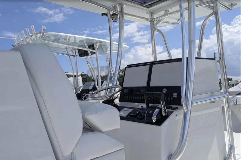 Slide: The Image of 1985 Contender 25 Sport boat interior with seating and equipment details. - 7
