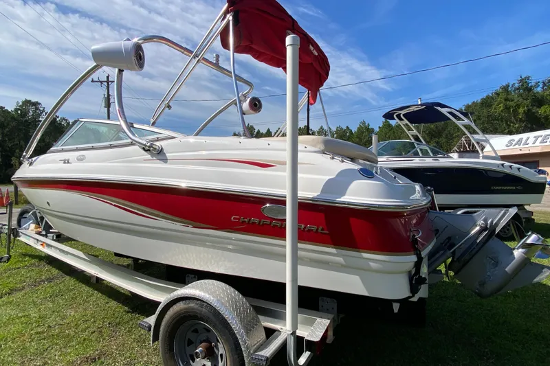 Slide: The Image of 2006 Chaparral 190 SSi boat on trailer, red and white design, outdoors. - 3