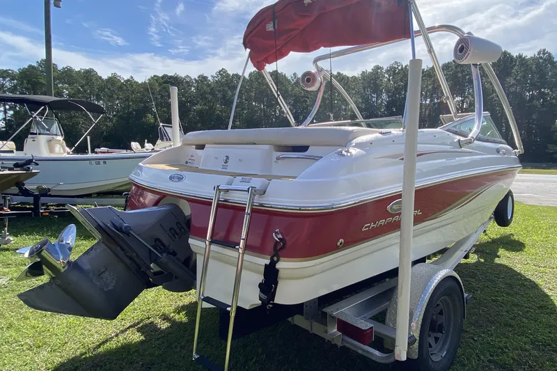 Slide: The Image of 2006 Chaparral 190 SSi boat on trailer, red and white design, parked outdoors. - 4