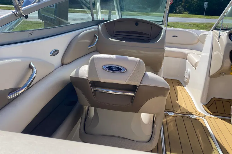 Slide: The Image of Interior of 2006 Chaparral 190 SSi boat with beige seating and wood accents. - 9