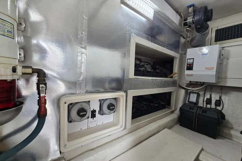 Slide: The Image of Engine room of 2004 Ocean Yachts 50 Super Sport, showcasing electrical systems and components. - 53