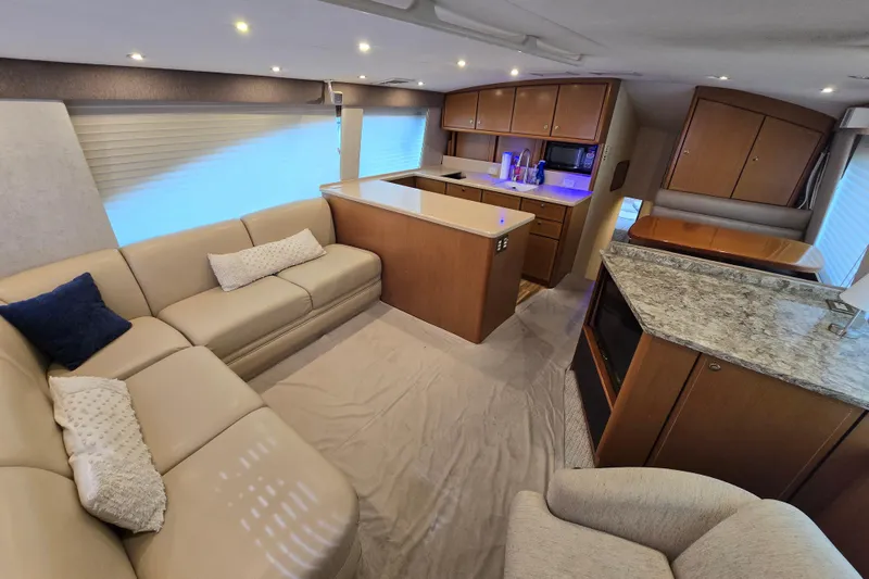 Slide: The Image of Luxurious interior of 2004 Ocean Yachts 50 Super Sport with modern kitchen and cozy seating. - 9