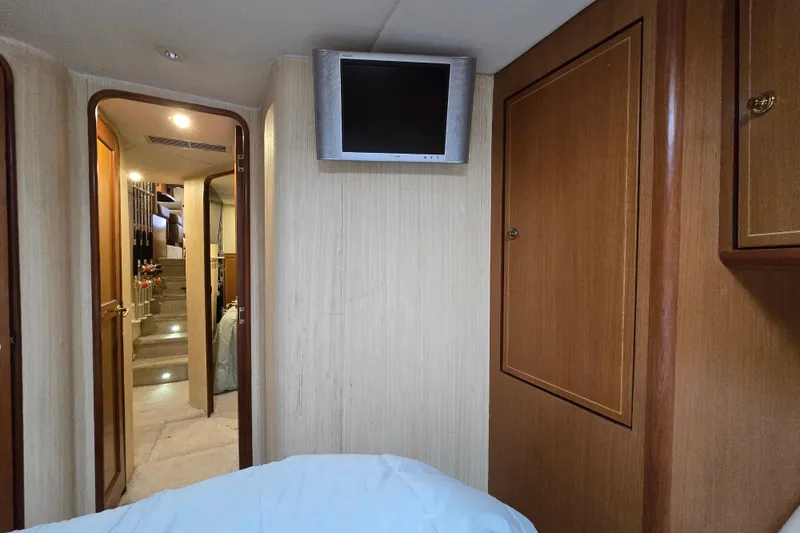 Slide: The Image of Interior of 2004 Ocean Yachts 50 Super Sport with TV and wooden cabinetry. - 22
