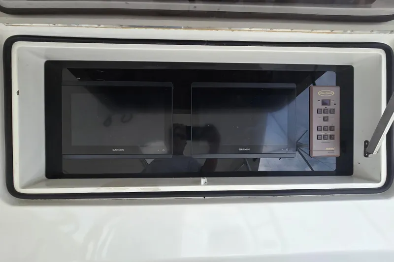 Slide: The Image of Control panel of 2004 Ocean Yachts 50 Super Sport with Garmin displays. - 30