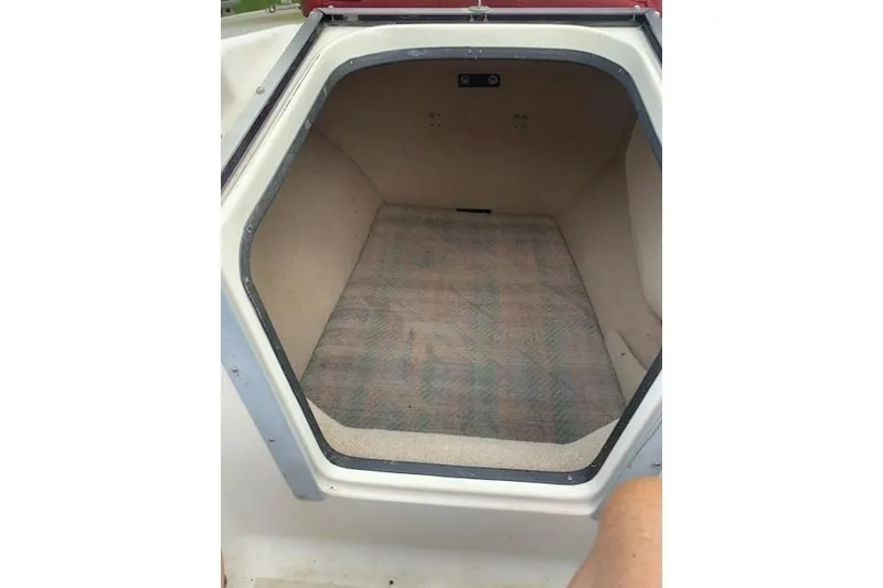 Slide: The Image of Interior cabin of 1991 Corsair F-27 #227 sailboat, featuring a compact, carpeted space. - 12