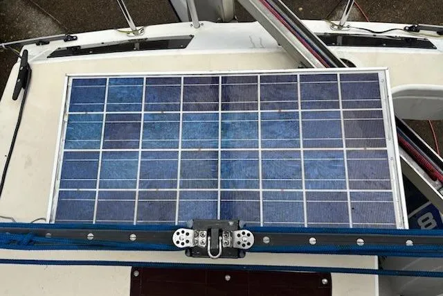 Slide: The Image of Solar panel on 1991 Corsair F-27 #227 sailboat deck, featuring rigging and hardware. - 15