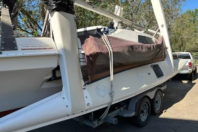 Slide: The Image of 1991 Corsair F-27 #227 sailboat on trailer, parked outdoors. - 3
