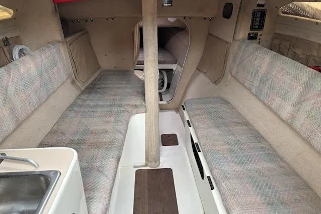 Slide: The Image of Interior of 1991 Corsair F-27 #227 sailboat, featuring cozy seating and compact design. - 6