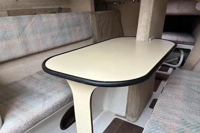 Slide: The Image of Interior of 1991 Corsair F-27 #227 sailboat with table and seating area. - 9