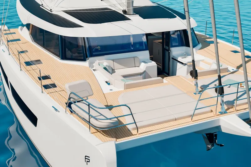 Slide: The Image of 2026 Fountaine Pajot 55 yacht with spacious deck and modern design on clear blue water. - 12