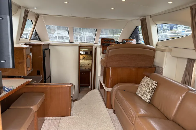 Slide: The Image of Interior of 2007 Carver 35 Super Sport yacht with luxurious seating and helm station. - 11