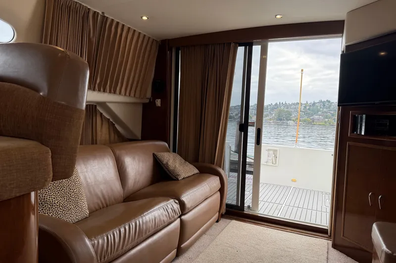 Slide: The Image of Interior of 2007 Carver 35 Super Sport yacht with leather sofa and lake view. - 15