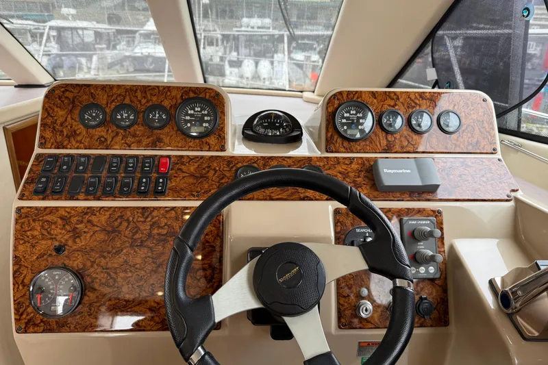 Slide: The Image of 2007 Carver 35 Super Sport helm with woodgrain dashboard and steering wheel. - 12