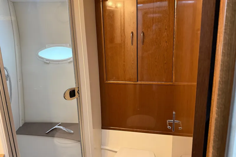 Slide: The Image of Bathroom interior of 2007 Carver 35 Super Sport yacht with wooden cabinets. - 19