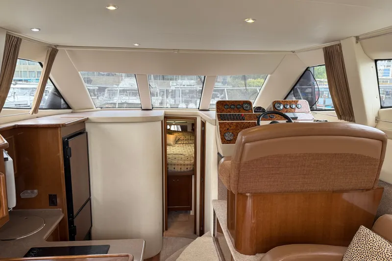 Slide: The Image of Interior of 2007 Carver 35 Super Sport yacht with helm and cabin view. - 21