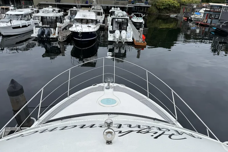 Slide: The Image of Bow view of 2007 Carver 35 Super Sport yacht docked in a marina. - 8