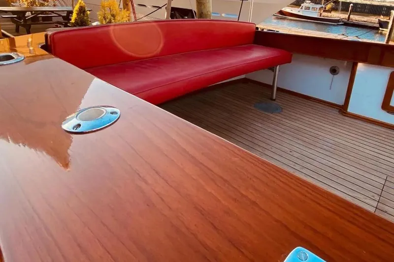 Slide: The Image of 1959 Forest E Johnson Prowler boat interior with red seating and wooden deck. - 9