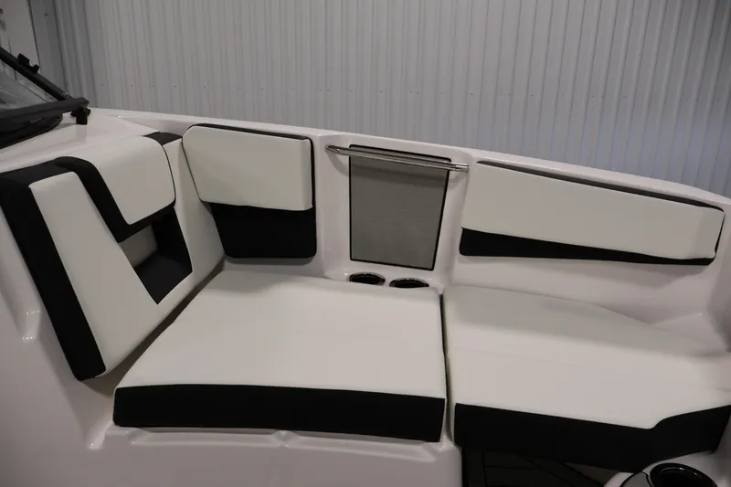 Slide: The Image of 2026 Yamaha Boats 222S interior seating with black and white upholstery. - 12