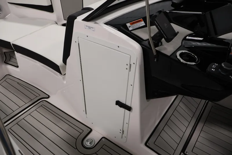 Slide: The Image of Interior view of 2026 Yamaha Boats 222S, featuring sleek seating and modern dashboard. - 15