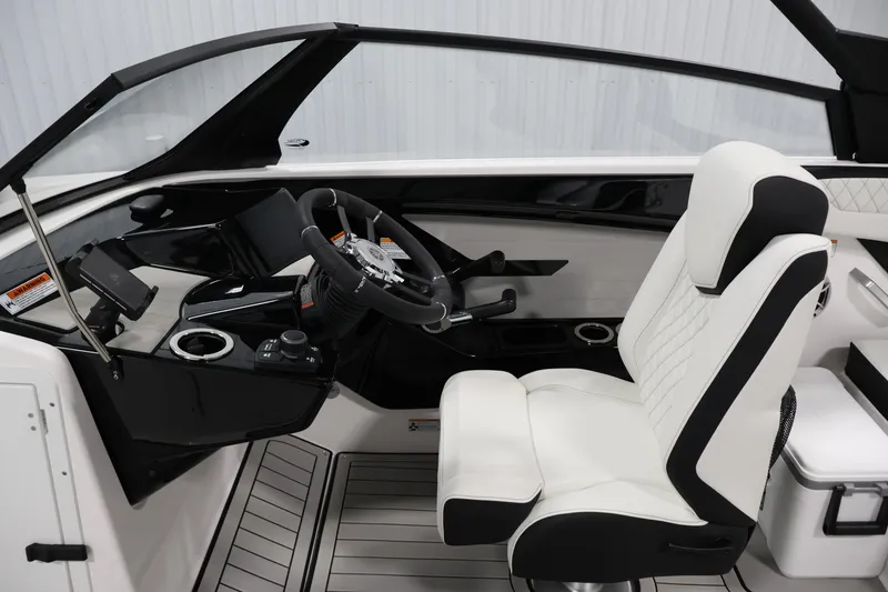Slide: The Image of Interior of 2026 Yamaha Boats 222S, featuring sleek steering and luxurious seating. - 16