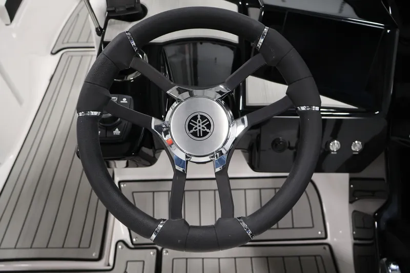 Slide: The Image of Steering wheel of 2026 Yamaha Boats 222S, featuring sleek design and modern controls. - 18