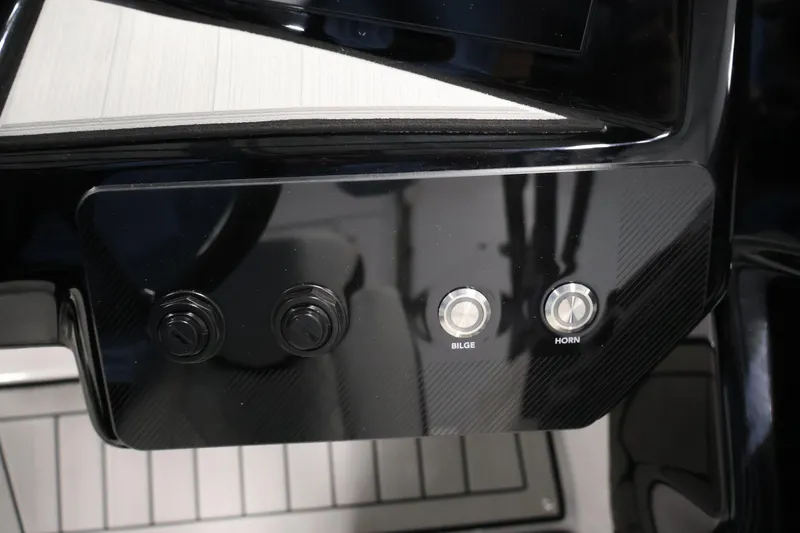 Slide: The Image of Control panel of 2026 Yamaha Boats 222S with bilge and horn buttons. - 22