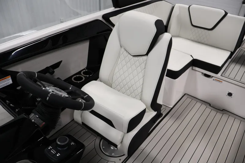 Slide: The Image of 2026 Yamaha Boats 222S interior with white leather seats and modern steering wheel. - 25