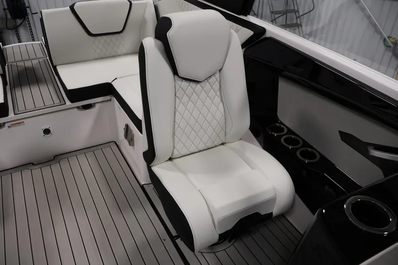 Slide: The Image of Luxurious interior seating of 2026 Yamaha Boats 222S with sleek design and cup holders. - 27