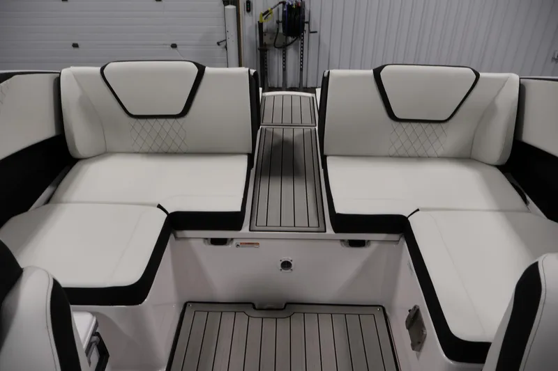 Slide: The Image of 2026 Yamaha Boats 222S interior with white cushioned seating and sleek design. - 28