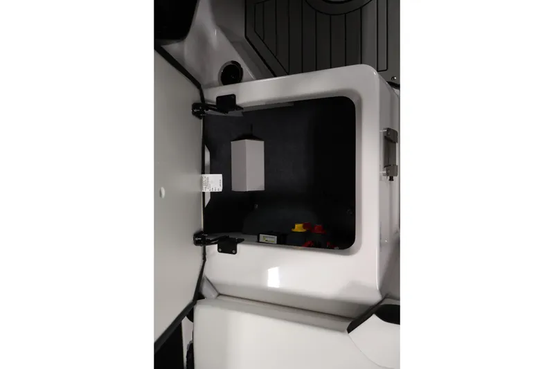 Slide: The Image of Storage compartment of 2026 Yamaha Boats 222S, featuring sleek design and secure latch. - 29
