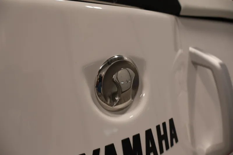 Slide: The Image of Close-up of 2026 Yamaha Boats 222S chrome detail and logo. - 33
