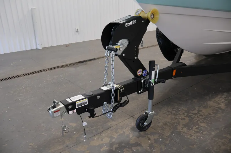Slide: The Image of Trailer hitch of 2026 Yamaha Boats 222S, featuring secure chains and wheel support. - 34