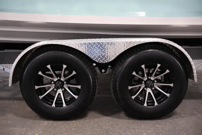 Slide: The Image of Trailer wheels of 2026 Yamaha Boats 222S with diamond plate fender. - 37