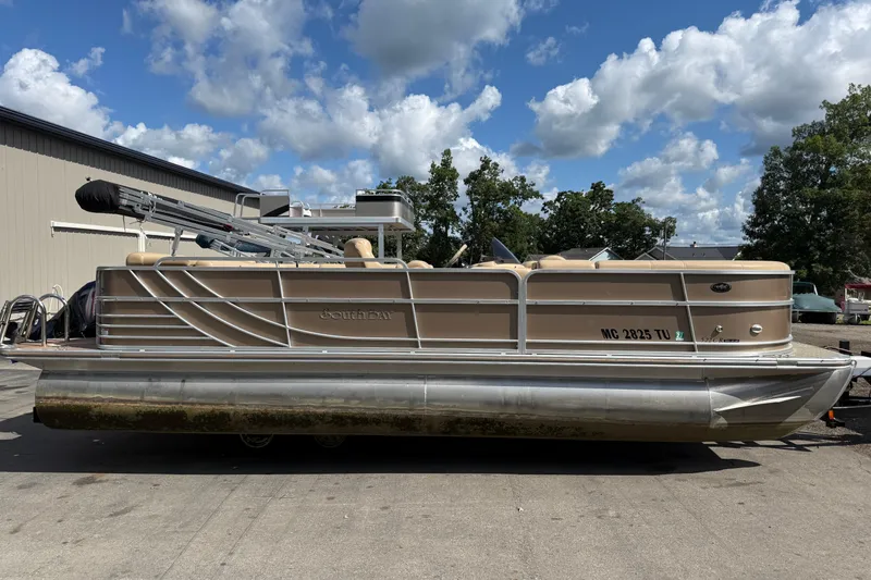 The Image of 2015 South Bay 522CR pontoon boat parked outdoors under a cloudy sky. - 1