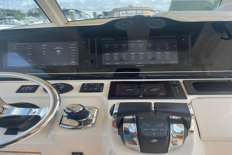 Slide: The Image of 2017 Scout 350 LXF boat dashboard with Garmin navigation displays and controls. - 6