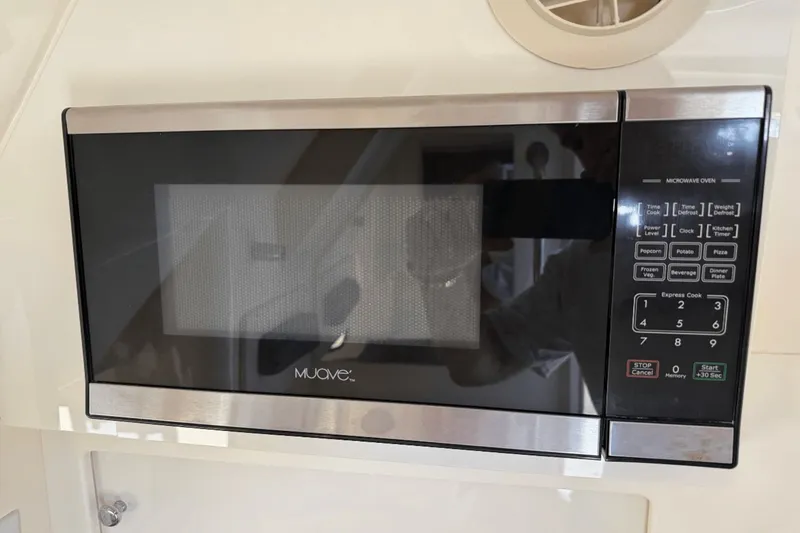 Slide: The Image of Built-in microwave oven on a 2017 Scout 350 LXF boat. - 9