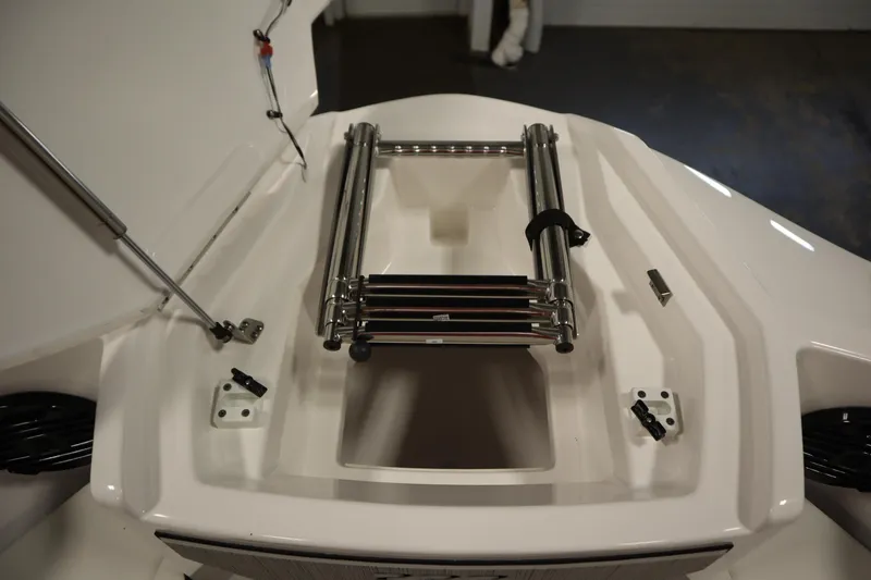 Slide: The Image of 2026 Yamaha Boats 222SD ladder compartment, featuring stainless steel retractable ladder. - 12