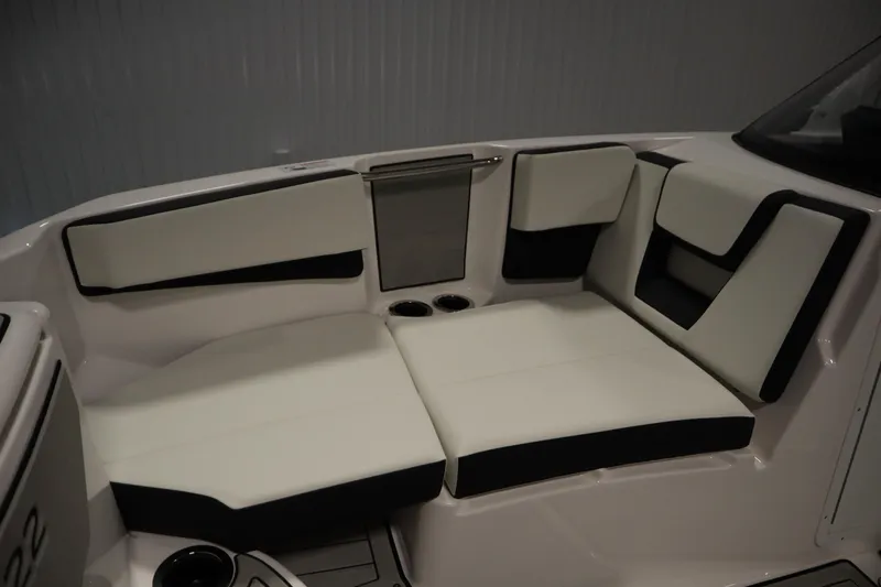 Slide: The Image of 2026 Yamaha Boats 222SD interior seating with sleek white and black upholstery. - 14