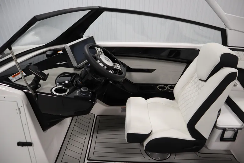 Slide: The Image of 2026 Yamaha Boats 222SD cockpit with modern steering, touchscreen, and luxurious seating. - 18