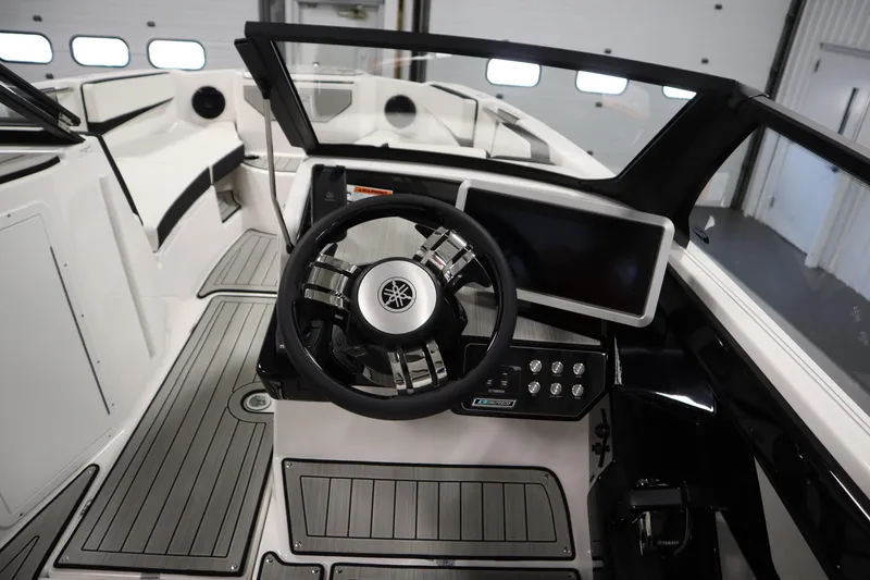 Slide: The Image of 2026 Yamaha Boats 222SD cockpit with steering wheel and modern dashboard controls. - 19
