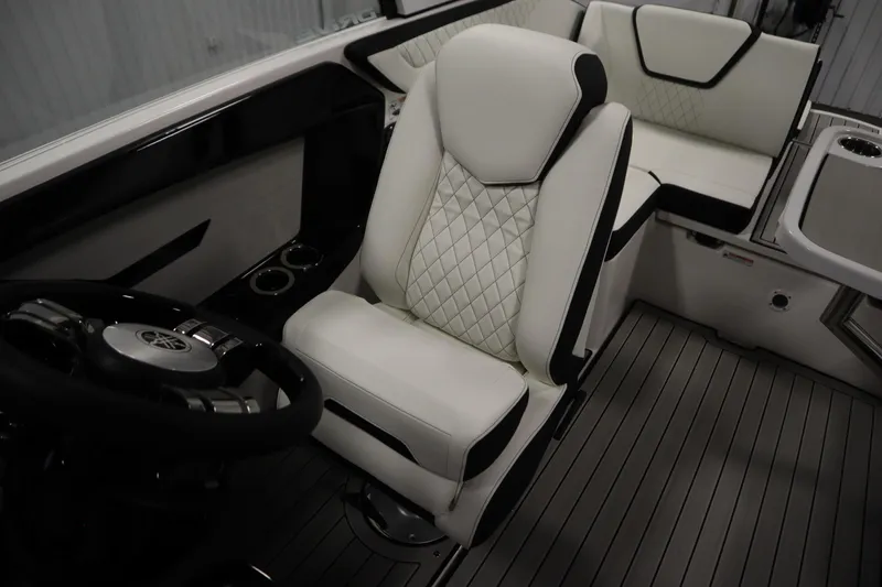Slide: The Image of 2026 Yamaha Boats 222SD interior with luxurious seating and modern steering wheel design. - 27