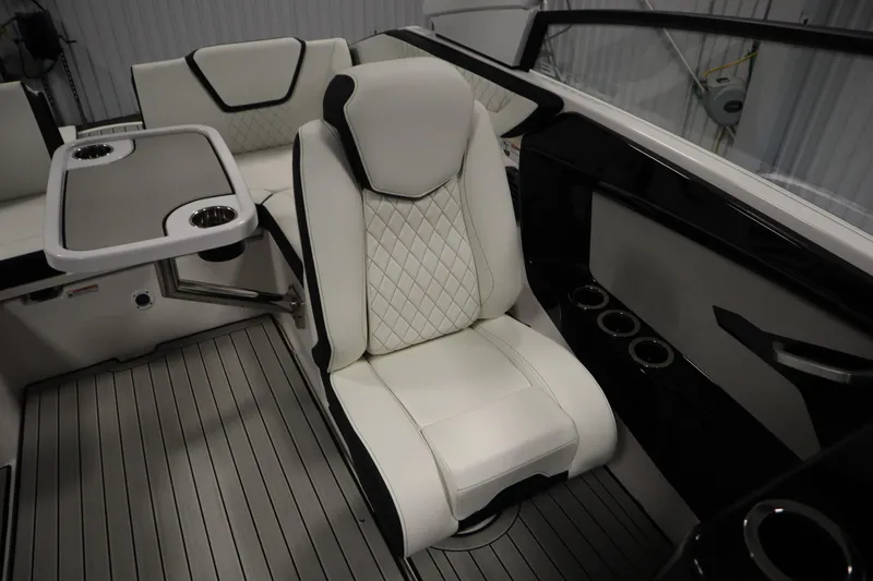 Slide: The Image of 2026 Yamaha Boats 222SD interior with luxurious seating and table, featuring modern design elements. - 33