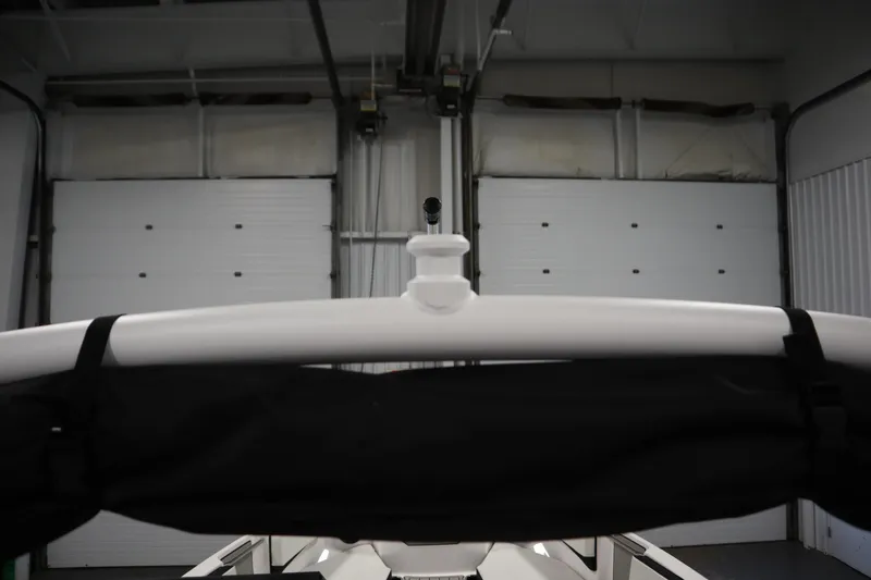 Slide: The Image of 2026 Yamaha Boats 222SD in a garage, showcasing its sleek design and structure. - 39