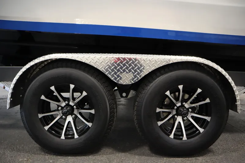 Slide: The Image of Trailer wheels of 2026 Yamaha Boats 222SD with diamond plate fender. - 47